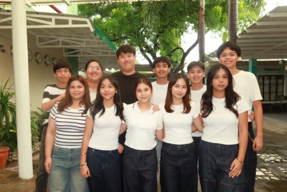 Students of Brightwoods School, Philippines, with their A'telaier fashion pieces