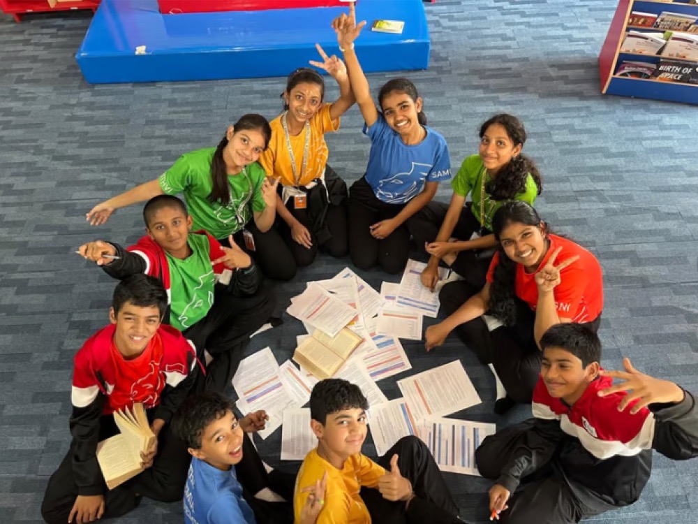 Students of The Premia Academy, India, with the Herbal Heirloom natural remedies book