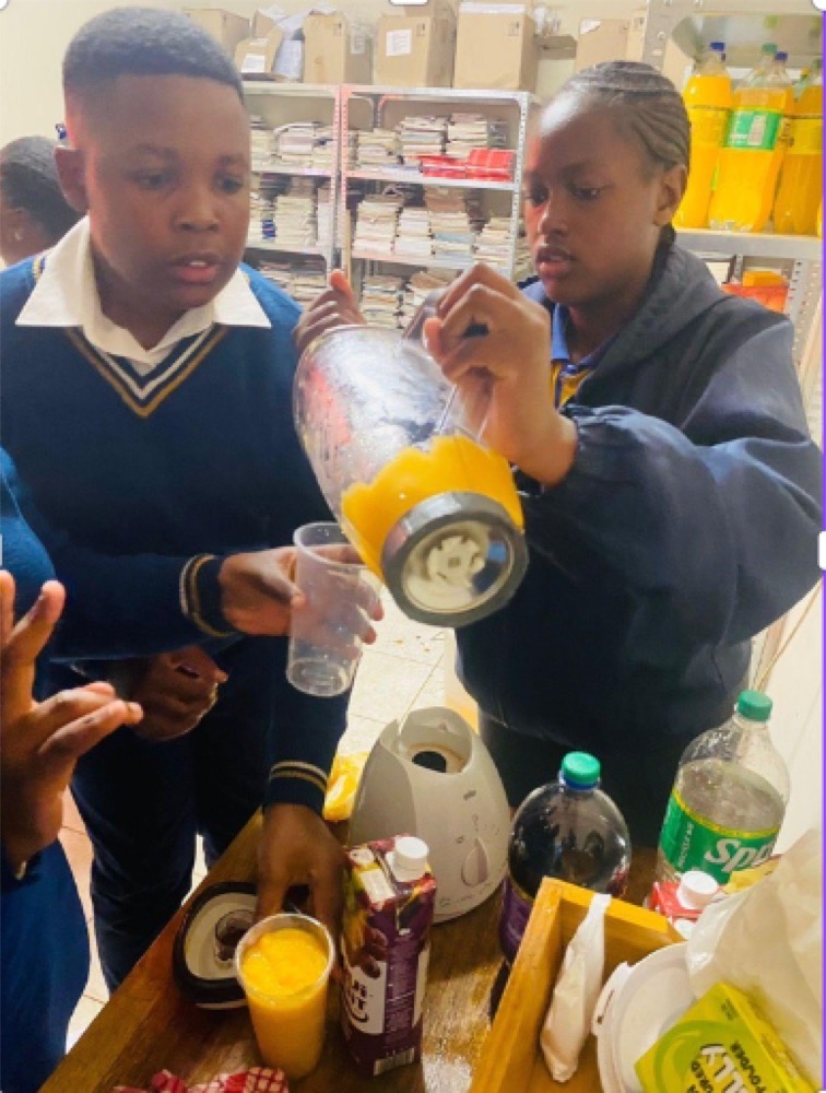 Students of Kondelelani Secondary School, South Africa, with Vital Sips natural juices